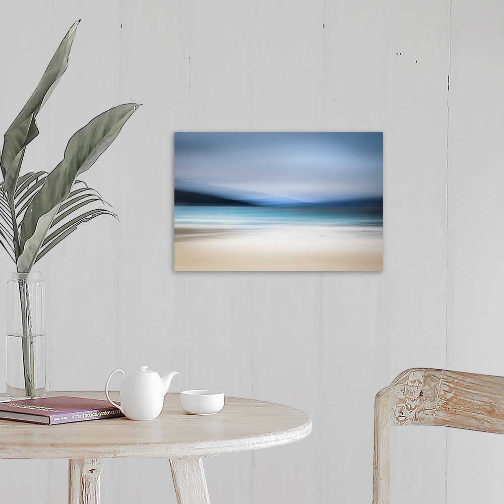 A farmhouse room featuring Calming abstract landscape beach scene with mountains, teal water, and grey sky.