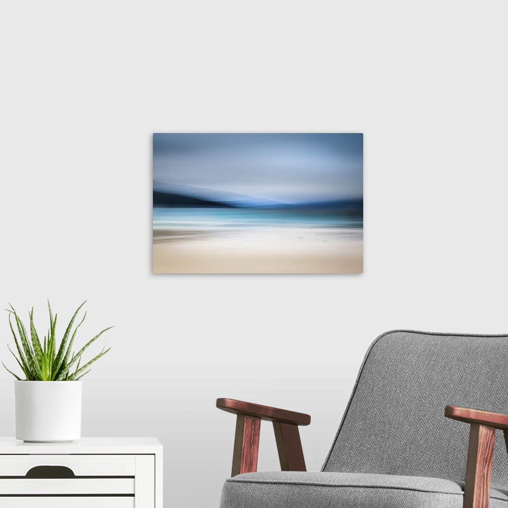 A modern room featuring Calming abstract landscape beach scene with mountains, teal water, and grey sky.