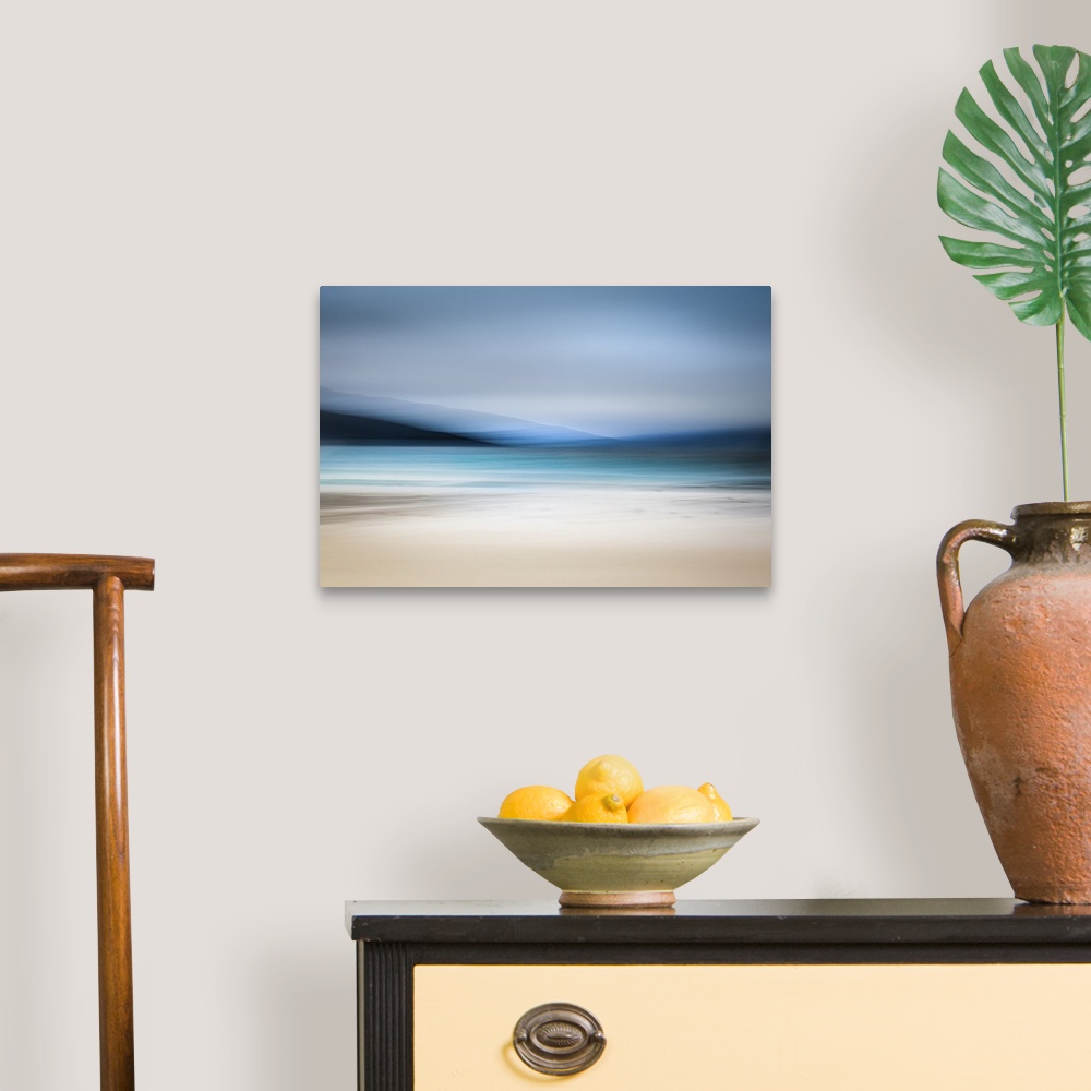 A traditional room featuring Calming abstract landscape beach scene with mountains, teal water, and grey sky.
