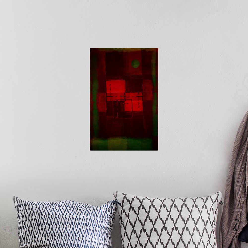A bohemian room featuring Geometric abstract artwork that consists of shades of red and green in polygonal shapes.