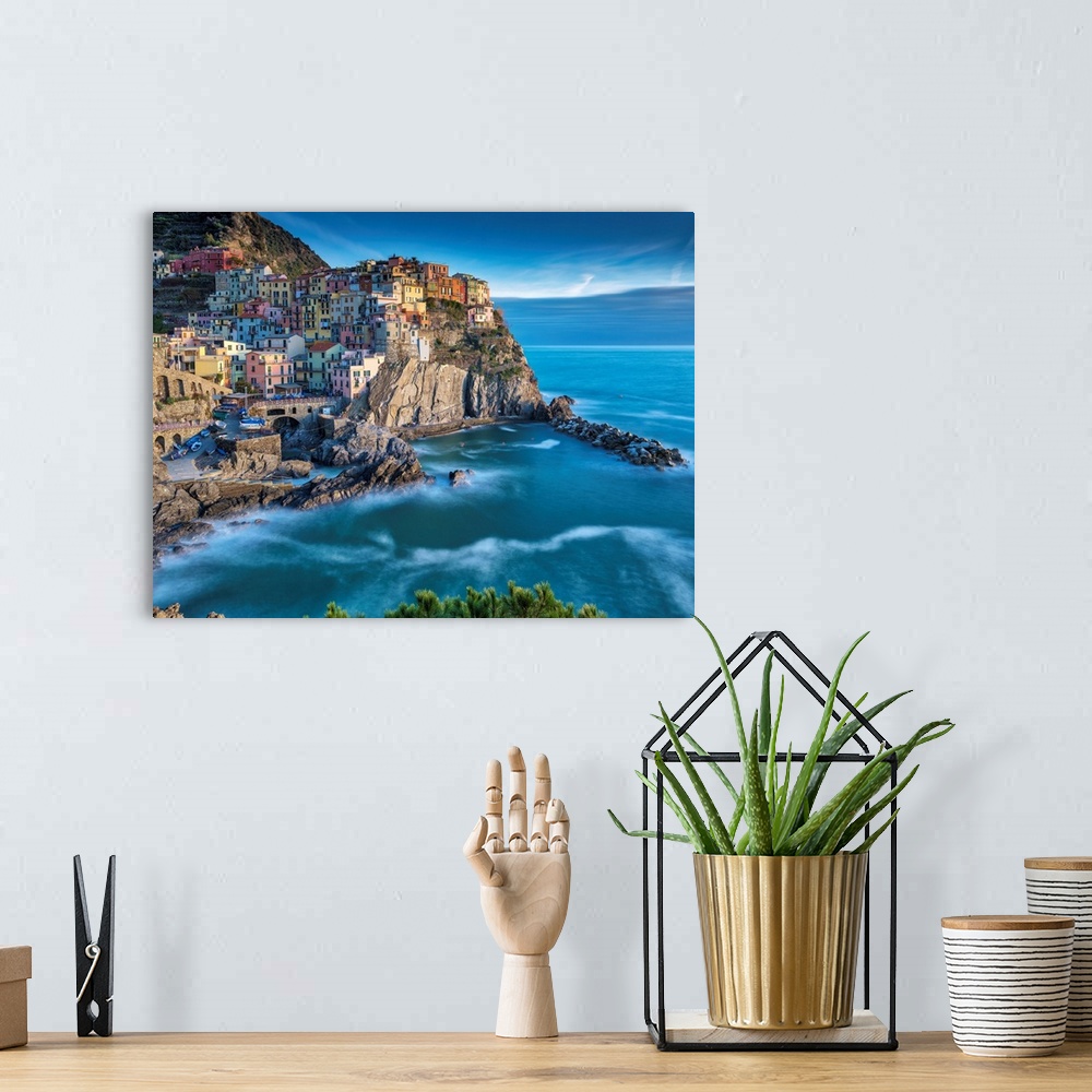A bohemian room featuring View of the Manarola, Riomaggiore, La Spezia, Liguria, Italy.