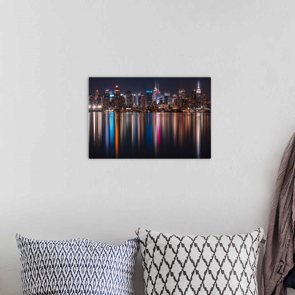 A bohemian room featuring Long exposure of Manhattan, NYC and its rainbow reflection in the Hudson River.