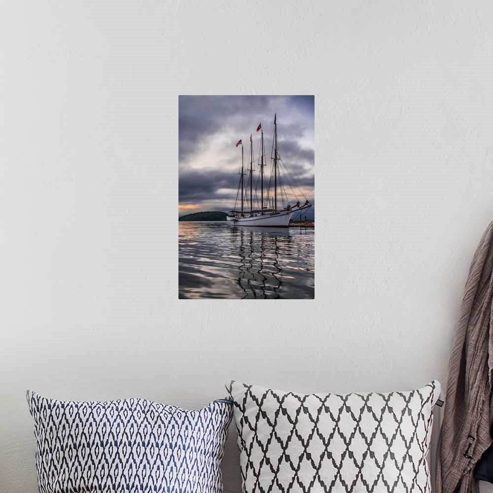 A bohemian room featuring Beautiful sailing ship Margaret Todd rests at it's pier amidst a dramatic atmospheric sunrise in ...