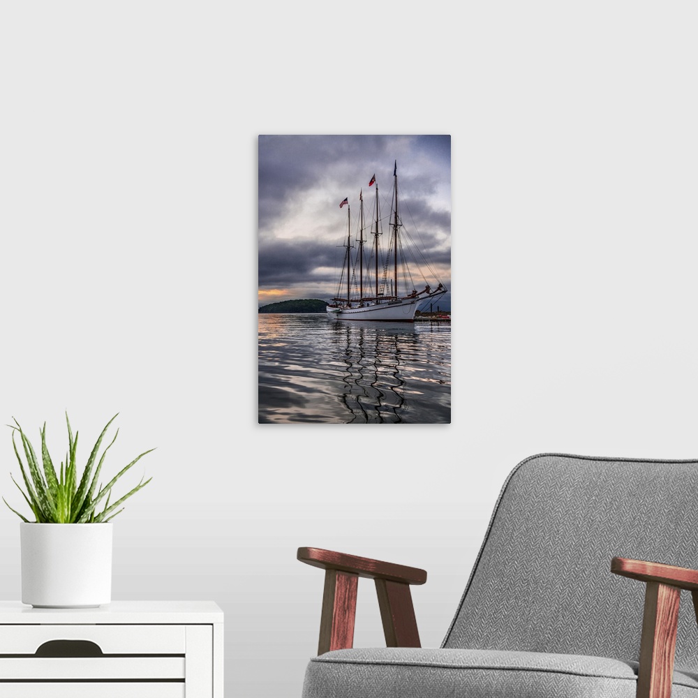 A modern room featuring Beautiful sailing ship Margaret Todd rests at it's pier amidst a dramatic atmospheric sunrise in ...
