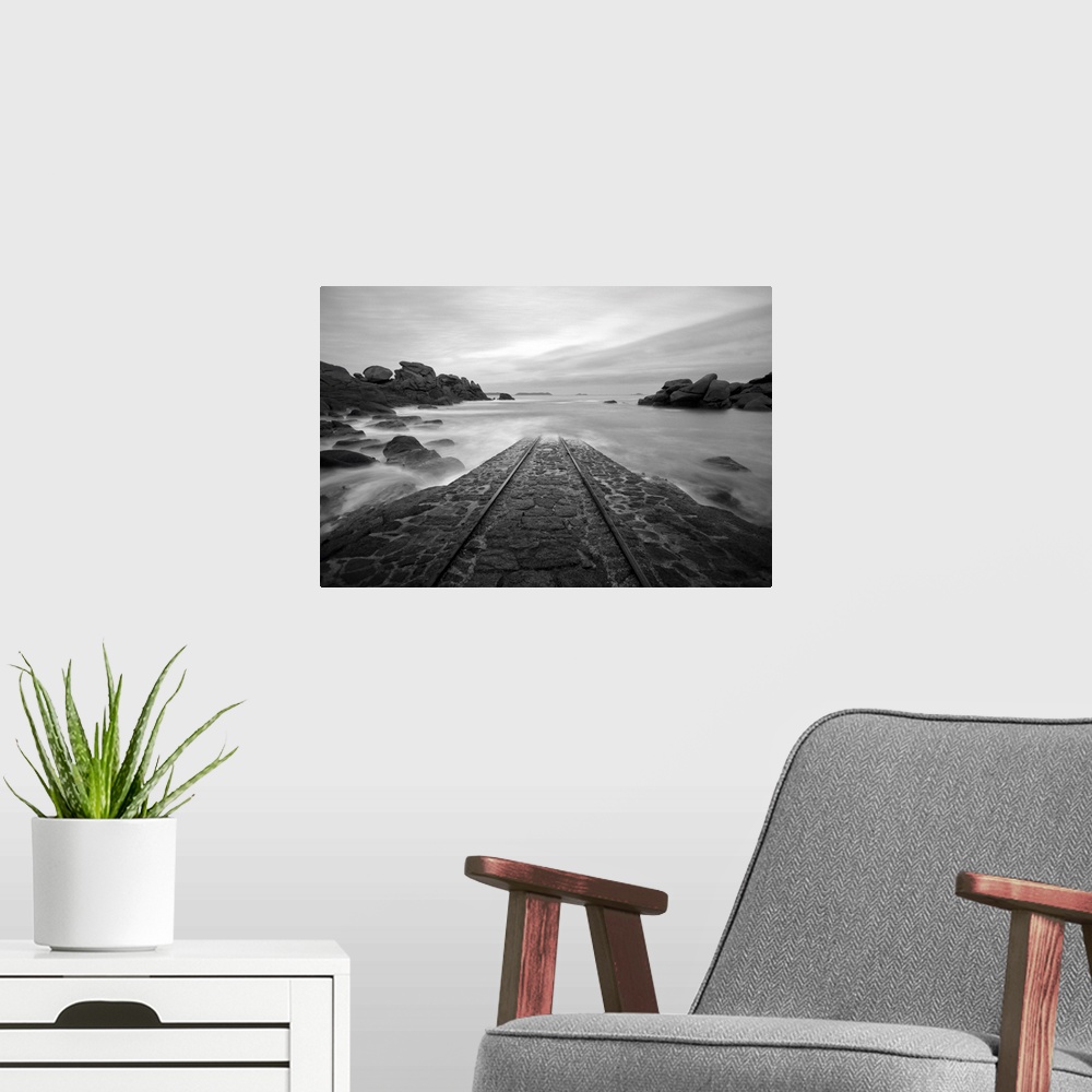 A modern room featuring A place in Brittany called, SNSM, road for boats going into the sea, in black and white.