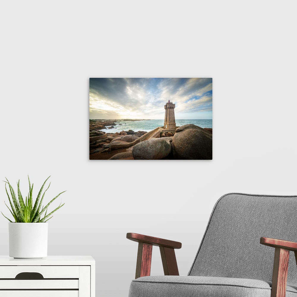 A modern room featuring Men Ruz lighthouse in Brittany in France on pink granit coast under a lighthing sky.
