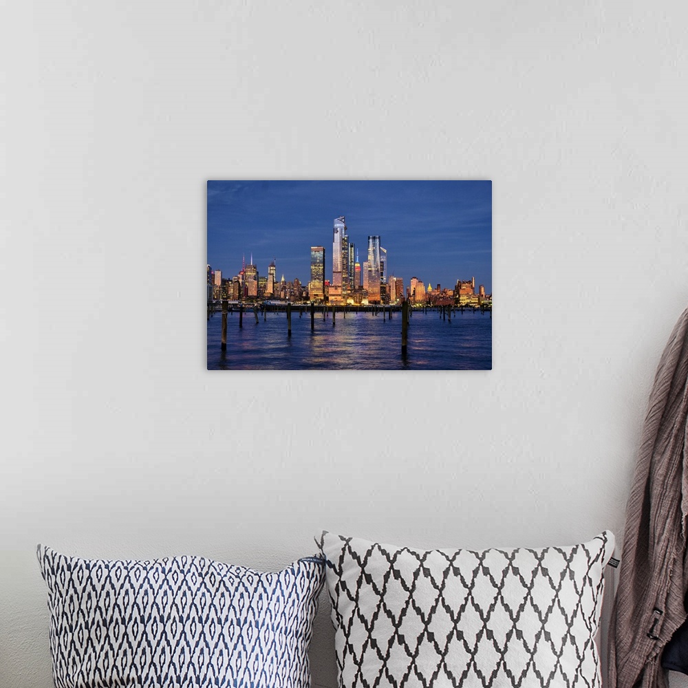 A bohemian room featuring Buildings of Midtown Manhattan Illuminated at Night as Viewed from Weehawken, New Jersey