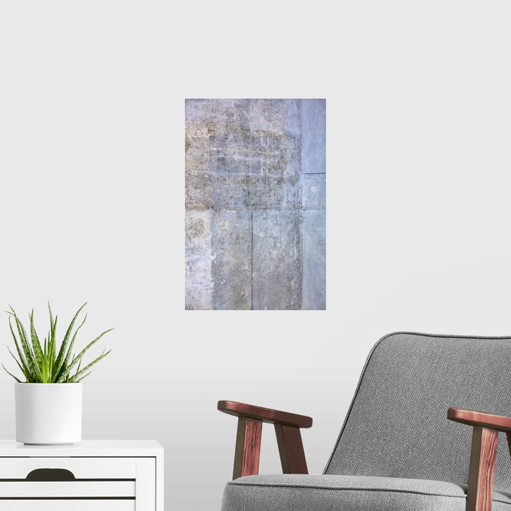 A modern room featuring Abstract artwork of cool colors with distressed textures throughout.