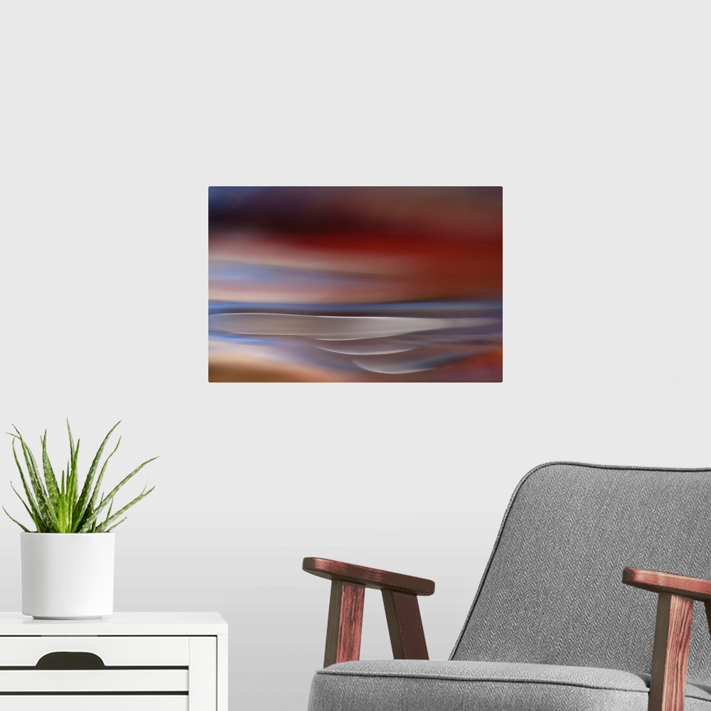 A modern room featuring Abstract modern art of a mix of color streaks.