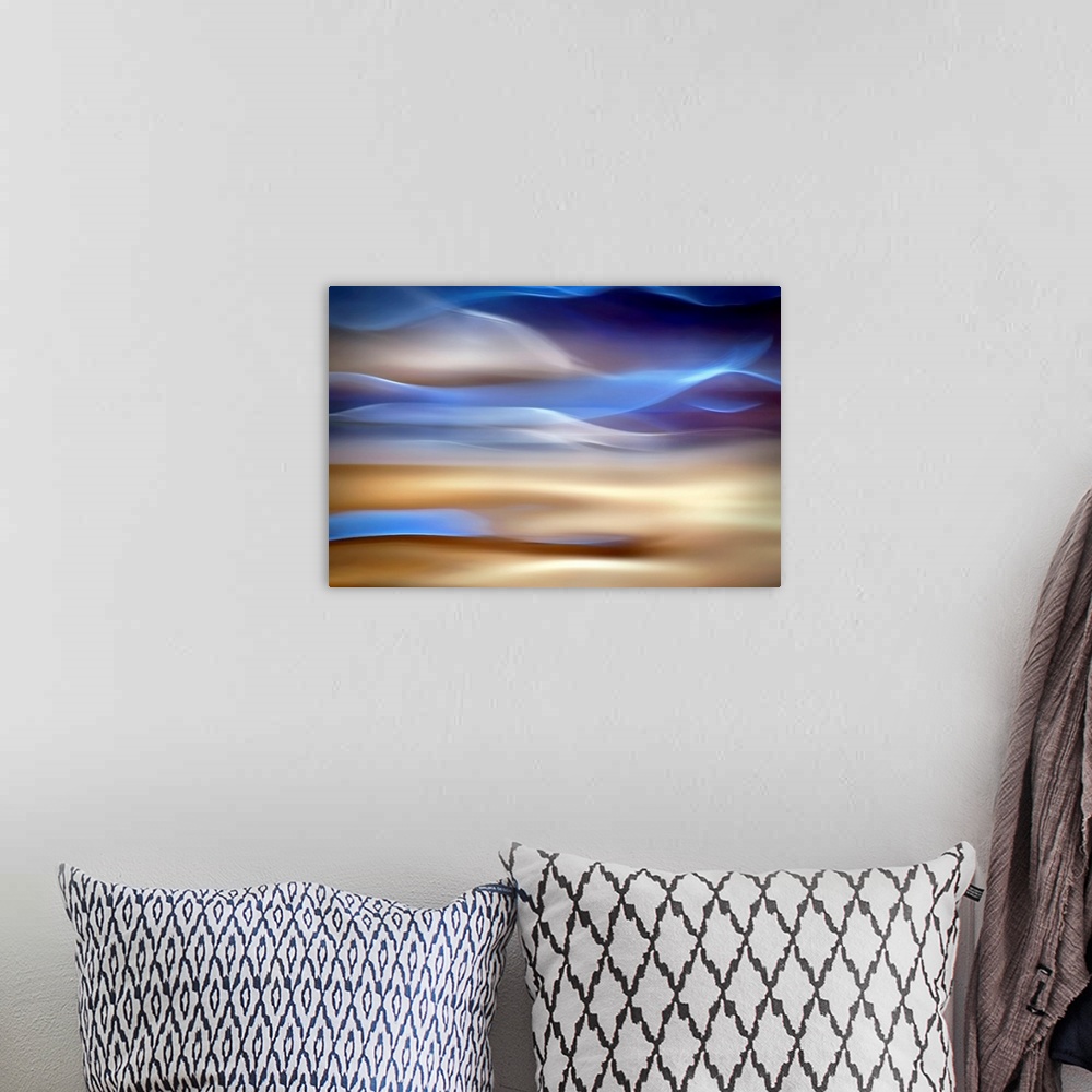 A bohemian room featuring An abstract piece of artwork that has waves of blue and tan running horizontally.