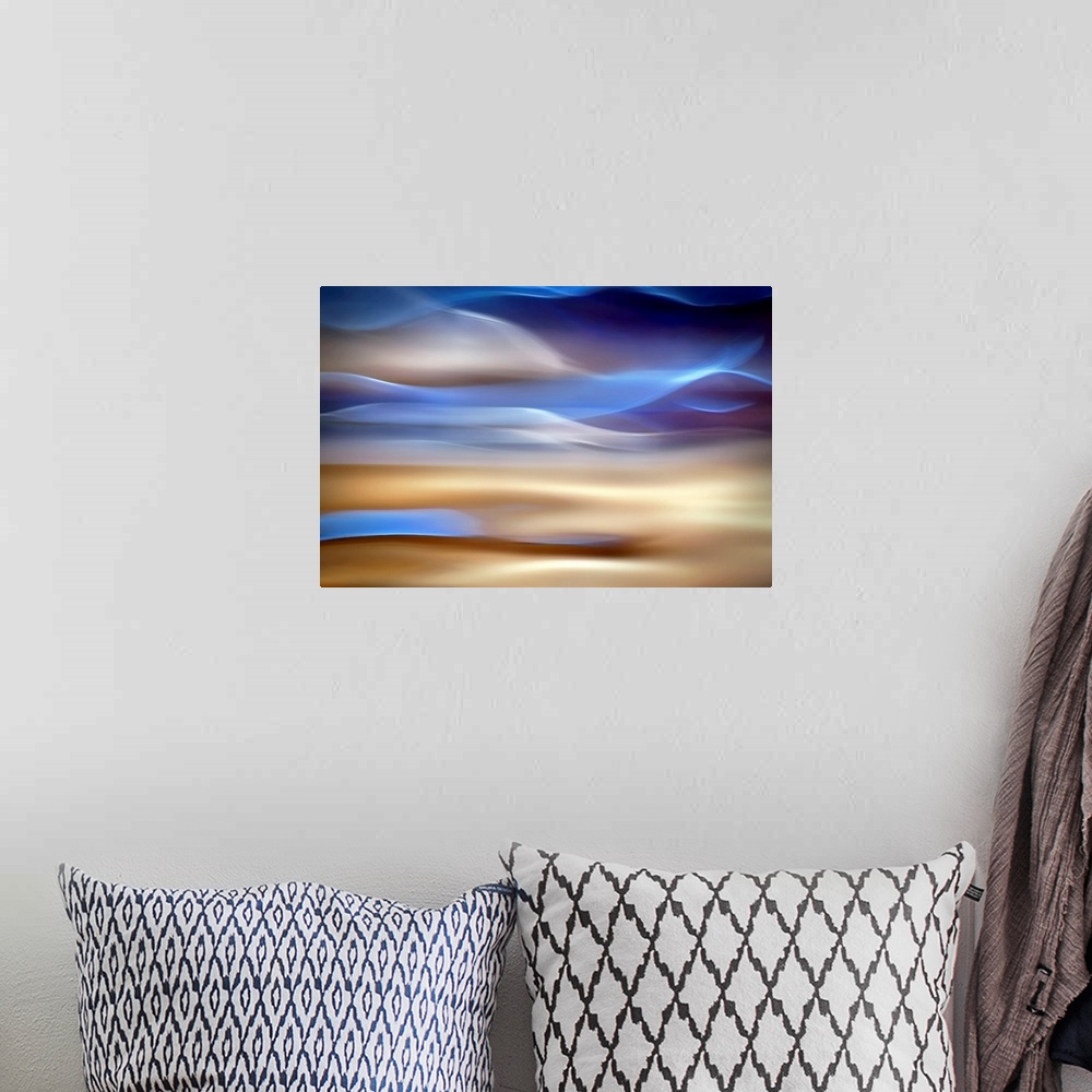 A bohemian room featuring An abstract piece of artwork that has waves of blue and tan running horizontally.