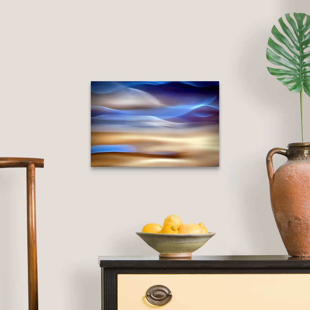 A traditional room featuring An abstract piece of artwork that has waves of blue and tan running horizontally.