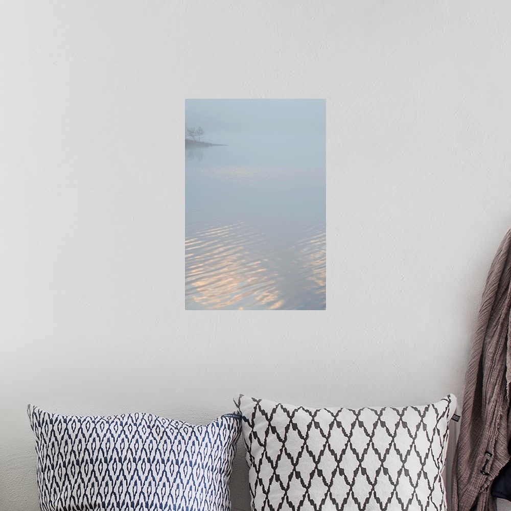 A bohemian room featuring Fine art photo of a lake covered in fog in the morning, with a little bit of light reflecting off...