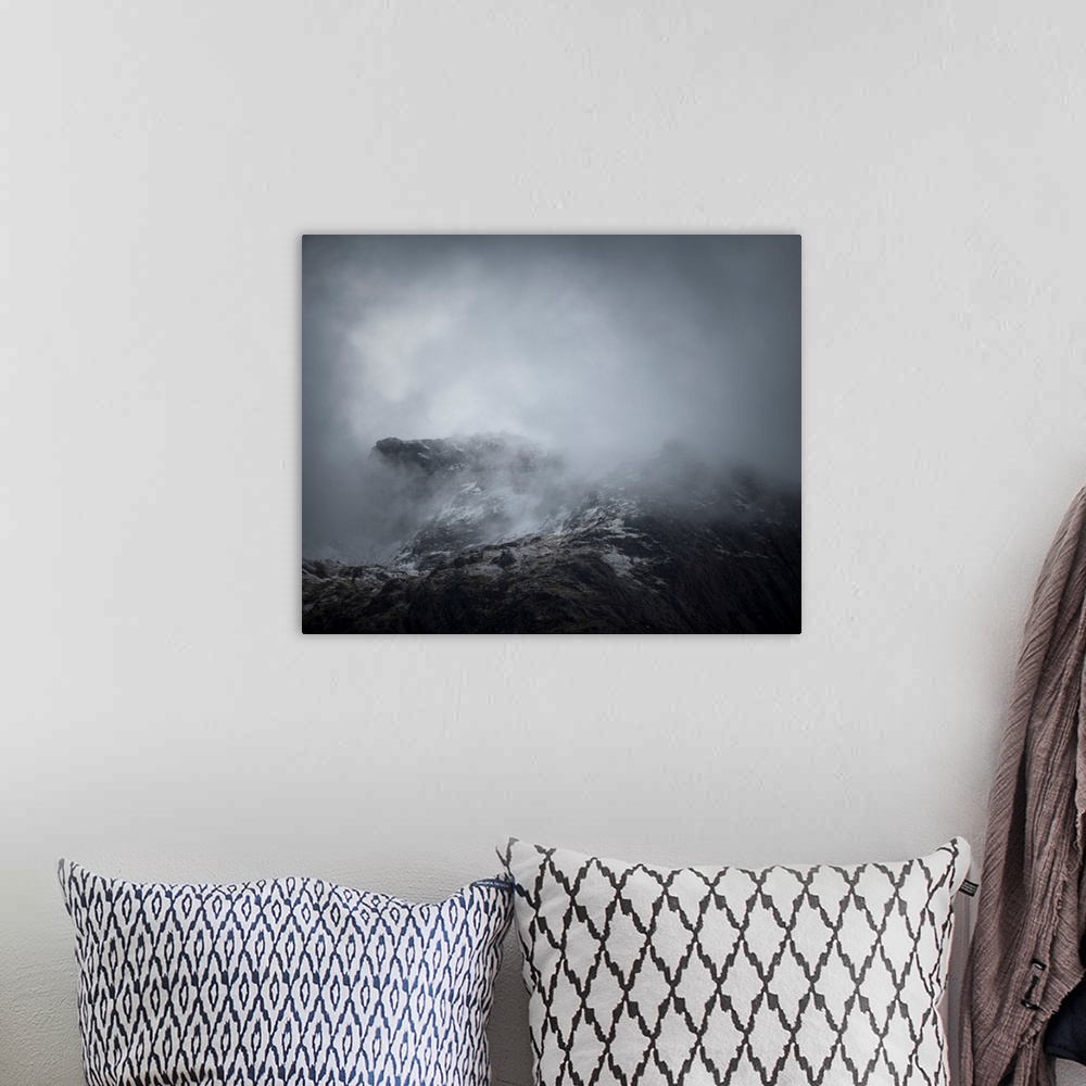 A bohemian room featuring Fine art photo of the side of a mountain covered in a deep fog.