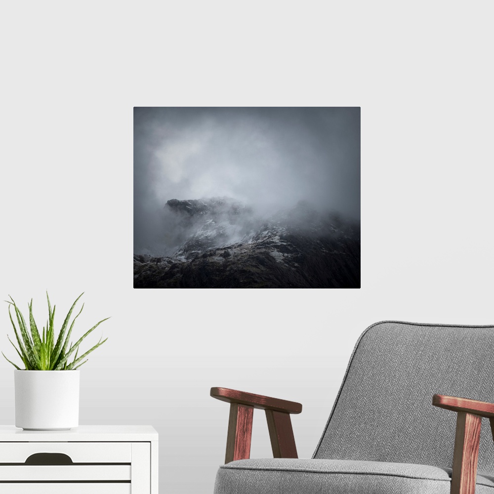 A modern room featuring Fine art photo of the side of a mountain covered in a deep fog.