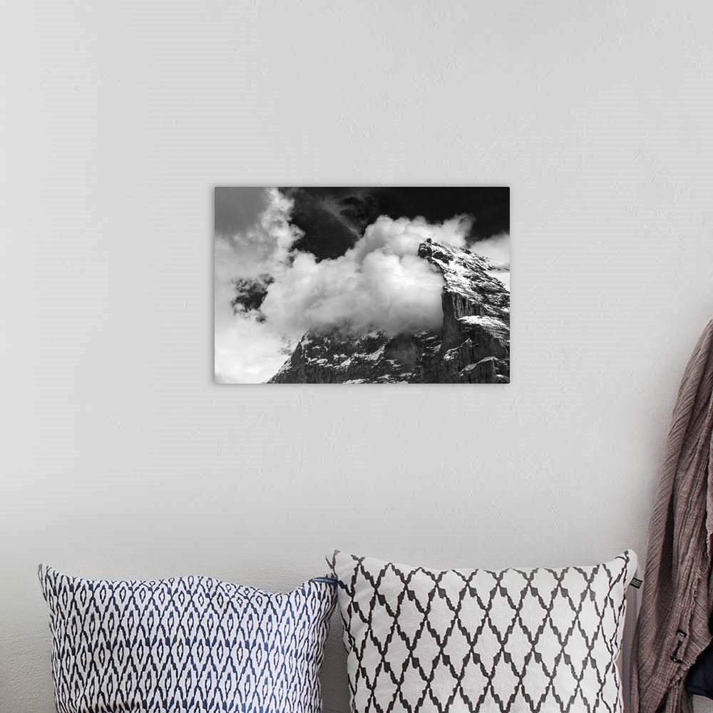 A bohemian room featuring Clouds in the mountains, black and white photo