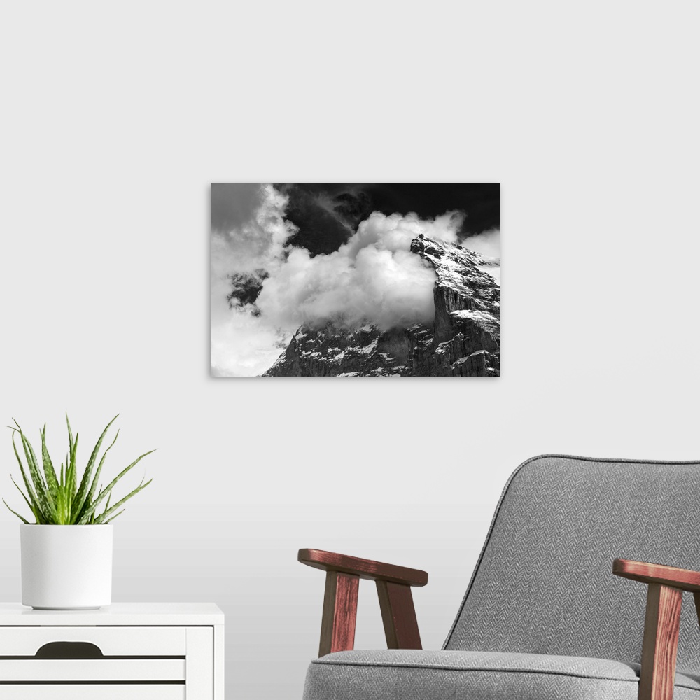 A modern room featuring Clouds in the mountains, black and white photo
