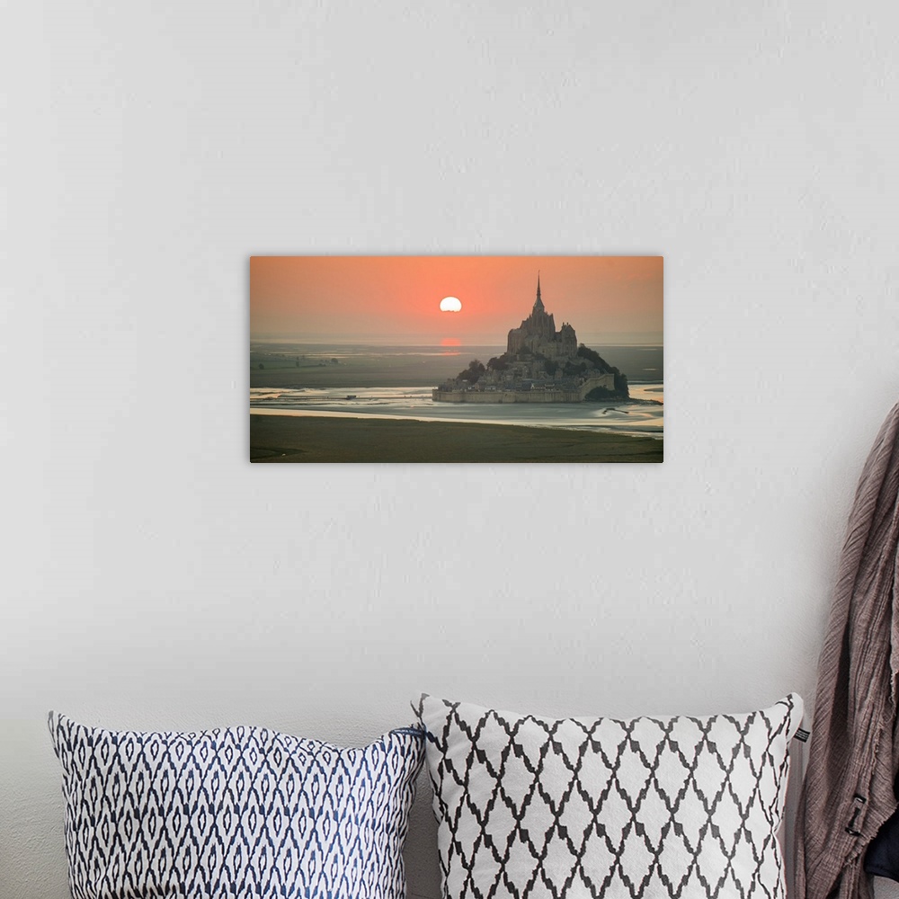 A bohemian room featuring Aerial panoramic view of Mont Saint Michel at sunset.
