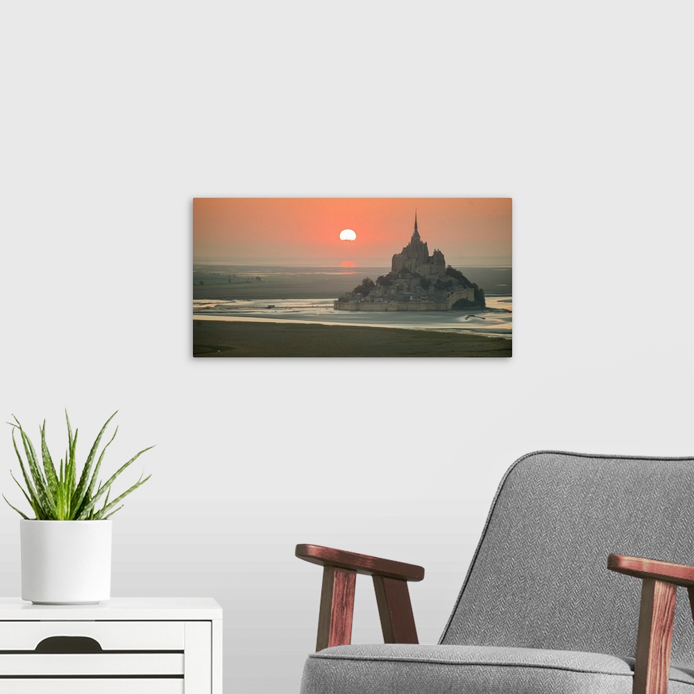 A modern room featuring Aerial panoramic view of Mont Saint Michel at sunset.