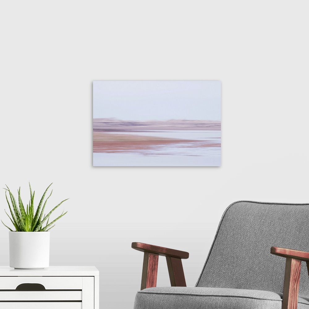 A modern room featuring Artistically blurred photo. A fresh morning breeze touches the cold water of these deserted marshes.