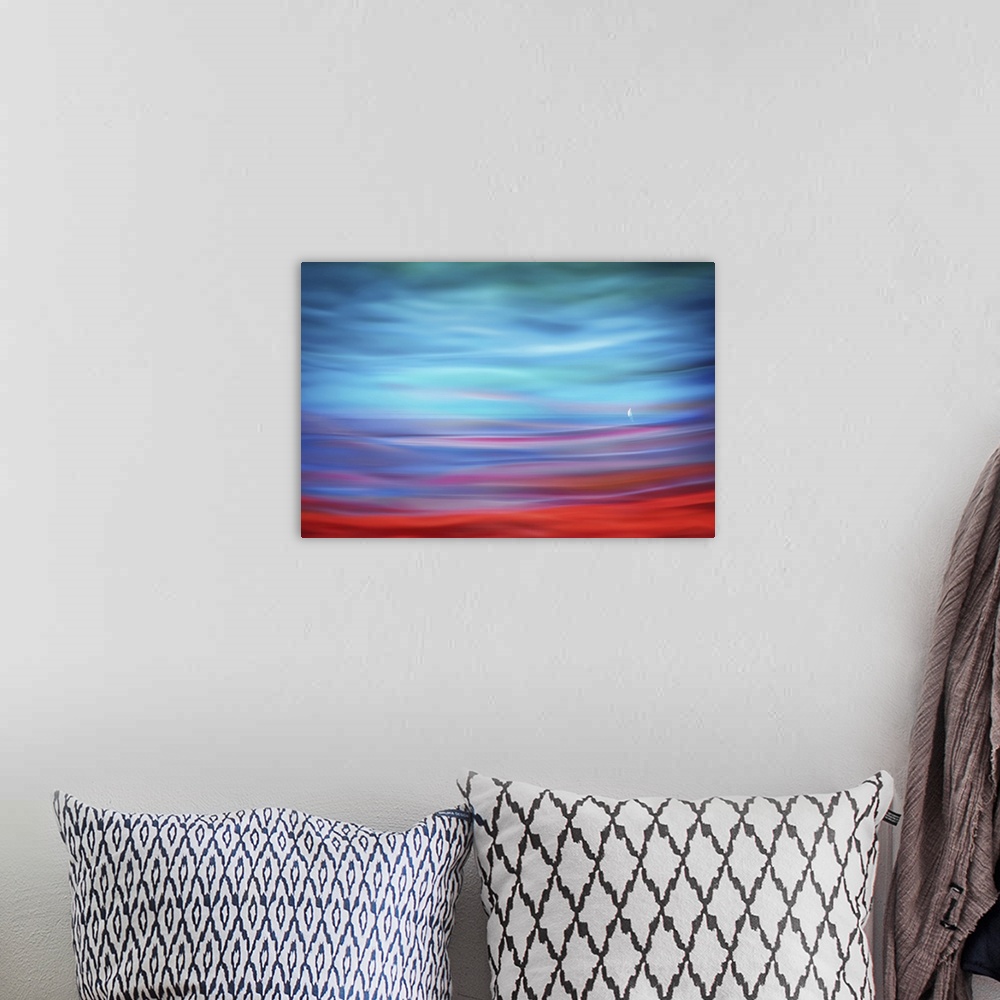 A bohemian room featuring Abstract photograph of a lone sailboat in the distance with a dreamy, rippling foreground effect ...