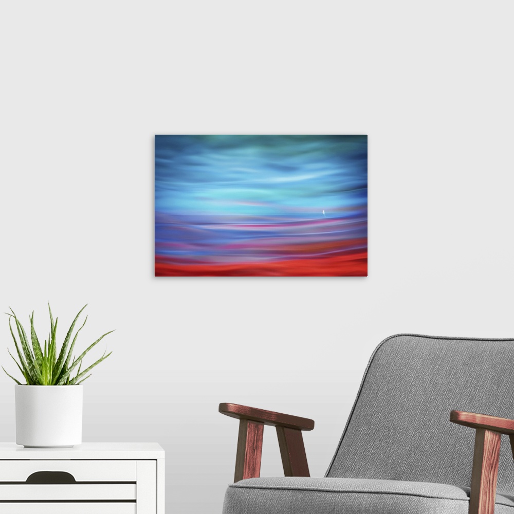 A modern room featuring Abstract photograph of a lone sailboat in the distance with a dreamy, rippling foreground effect ...
