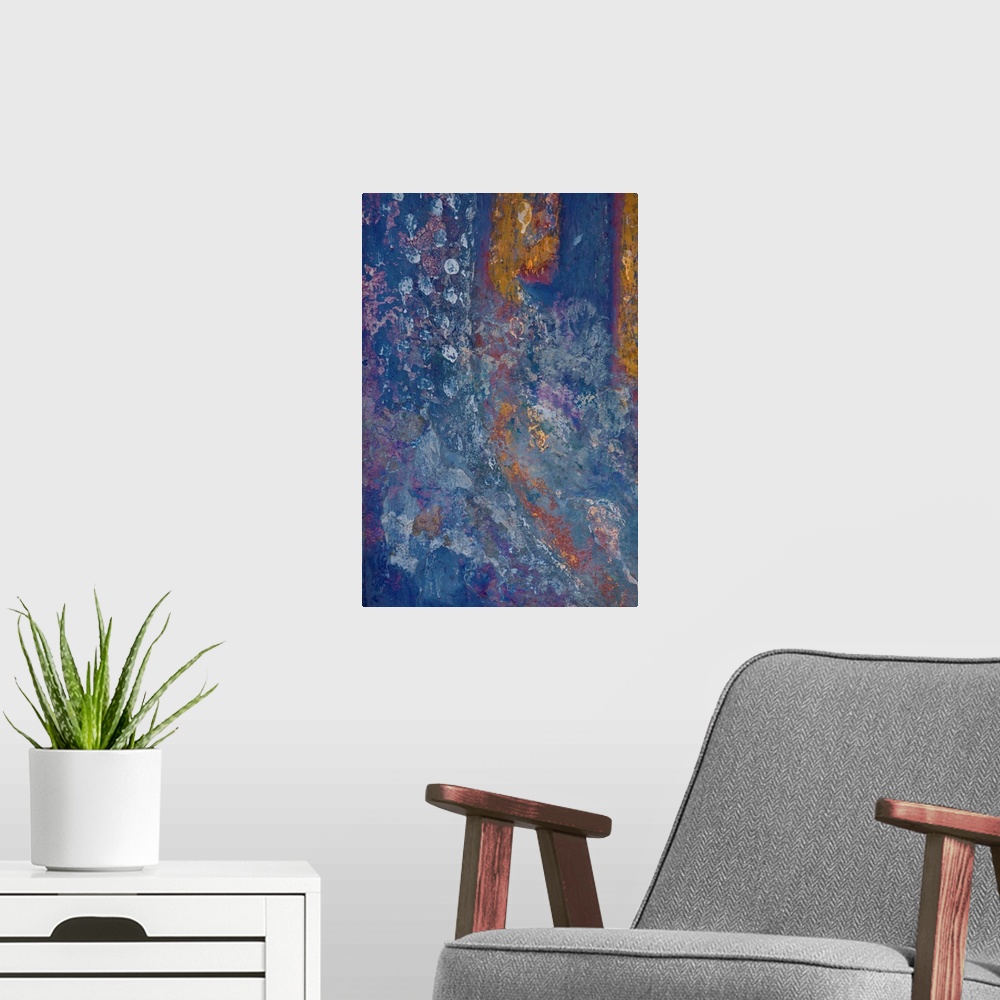 A modern room featuring An abstract expressionist image of shimmering textures in blues, russets and greens and pinks.