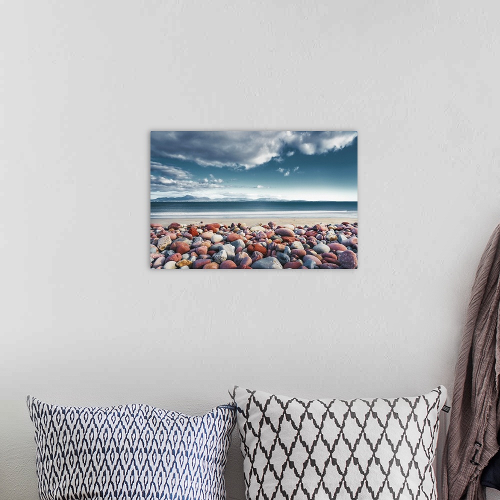A bohemian room featuring Mulranny Beach in Ireland with pebbles in the foreground