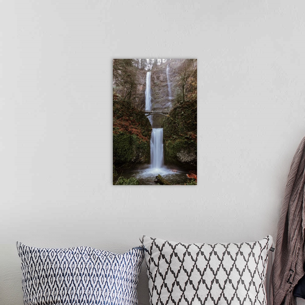 A bohemian room featuring Two tiered Multnomah Falls, the tallest waterfall in Oregon, in fall color.