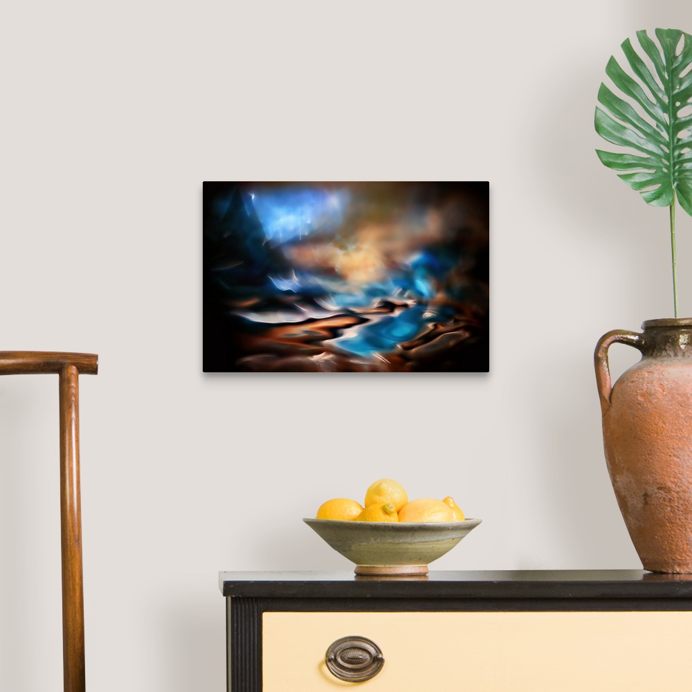 A traditional room featuring Abstract photograph in dark hues with bright blues.