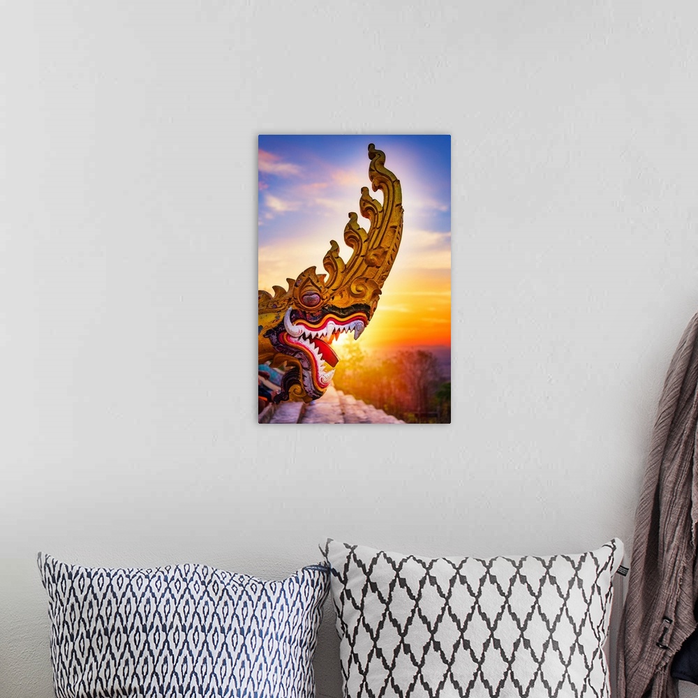 A bohemian room featuring A dragon's head close-up in front of a sunset in Asia