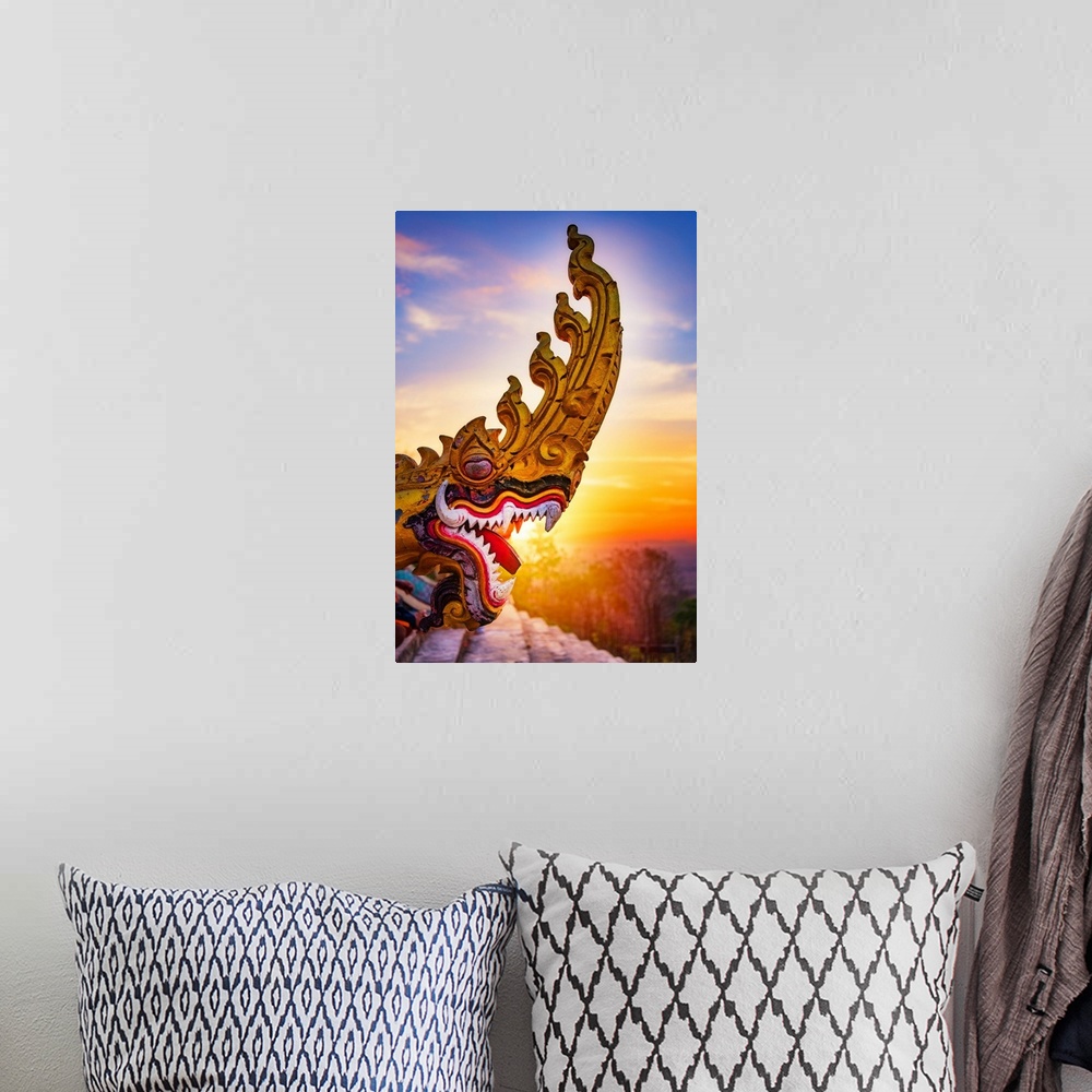 A bohemian room featuring A dragon's head close-up in front of a sunset in Asia