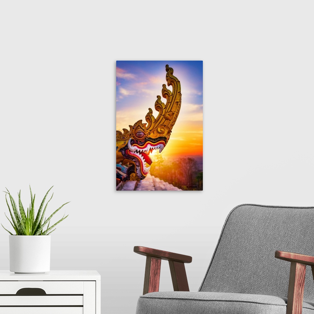 A modern room featuring A dragon's head close-up in front of a sunset in Asia