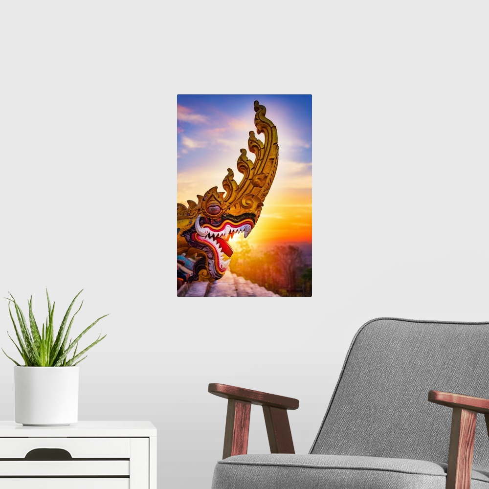 A modern room featuring A dragon's head close-up in front of a sunset in Asia