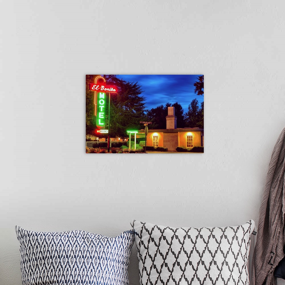 A bohemian room featuring Fine art photo of a motel in Napa Valley with bright neon signs.