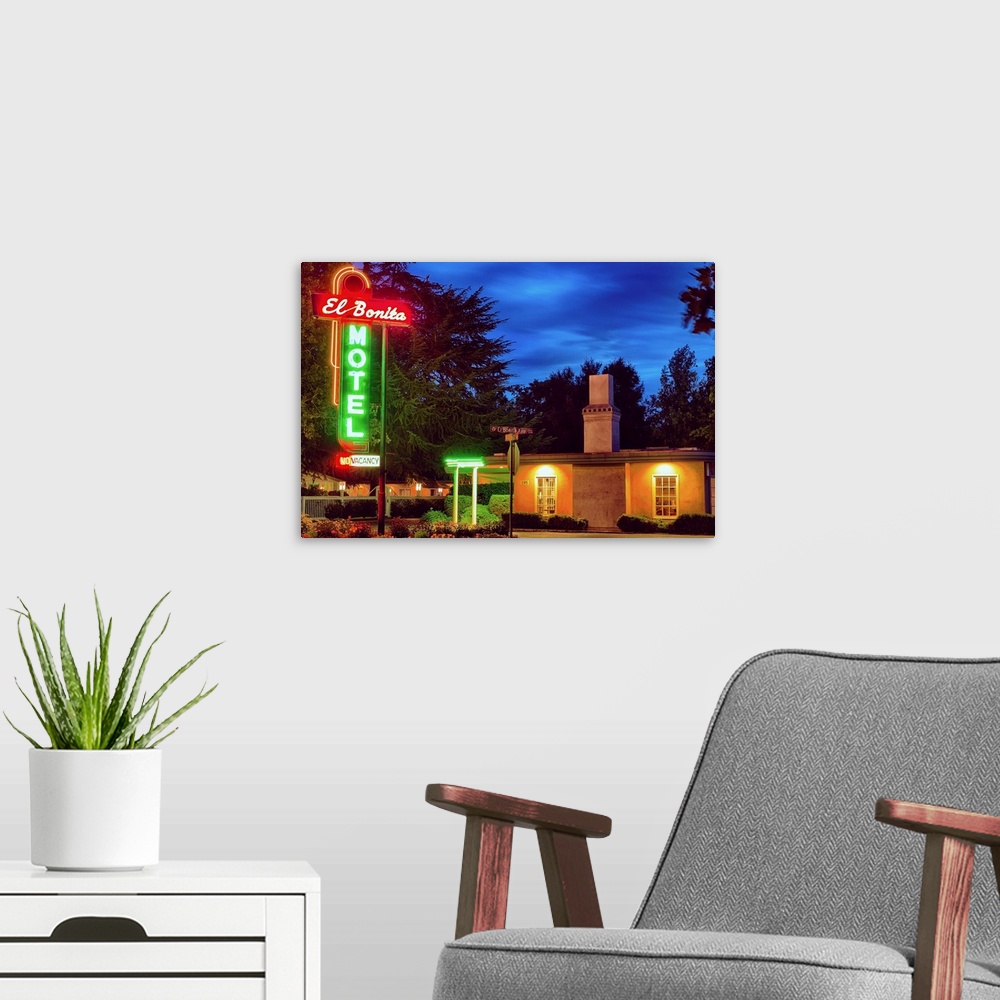 A modern room featuring Fine art photo of a motel in Napa Valley with bright neon signs.