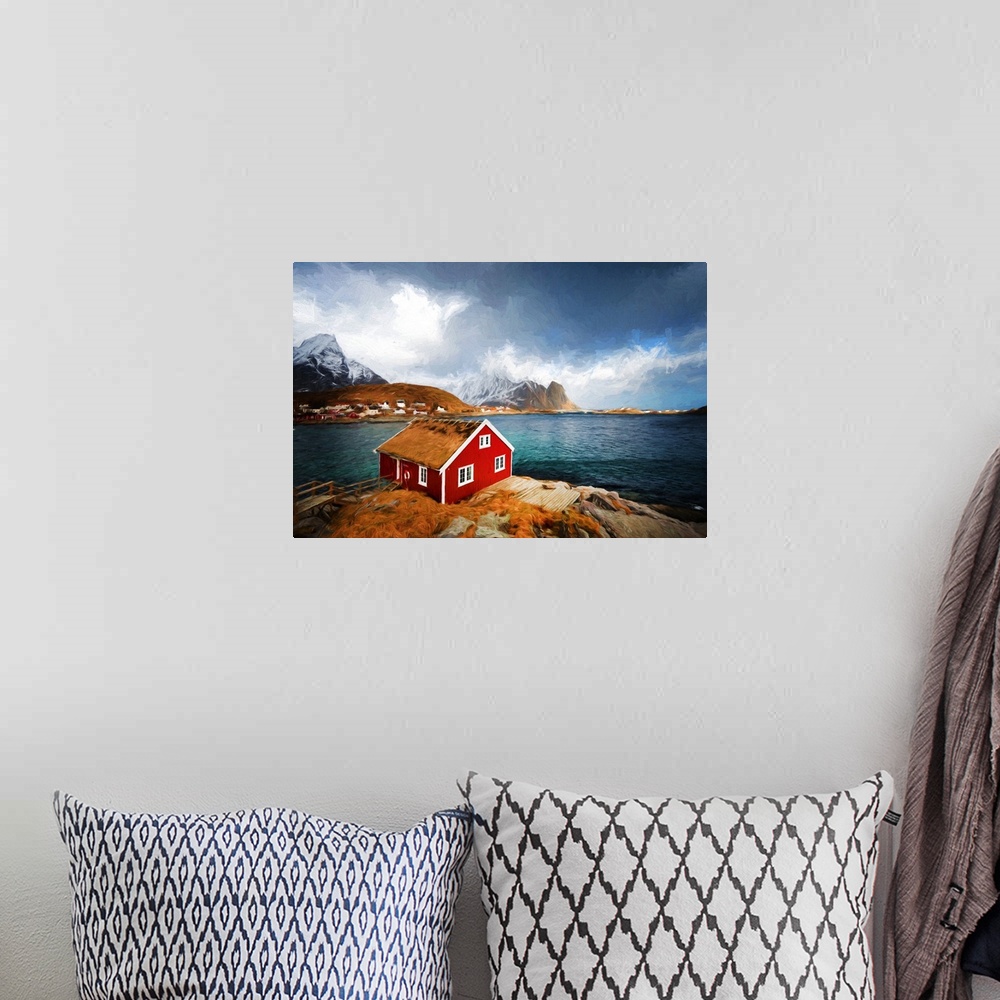A bohemian room featuring A photograph of a red house with a rugged mountain covered in snow in the background.