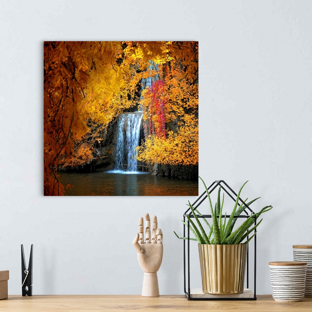 A bohemian room featuring Photograph of waterfall seen through the brightly colored autumn leaves.