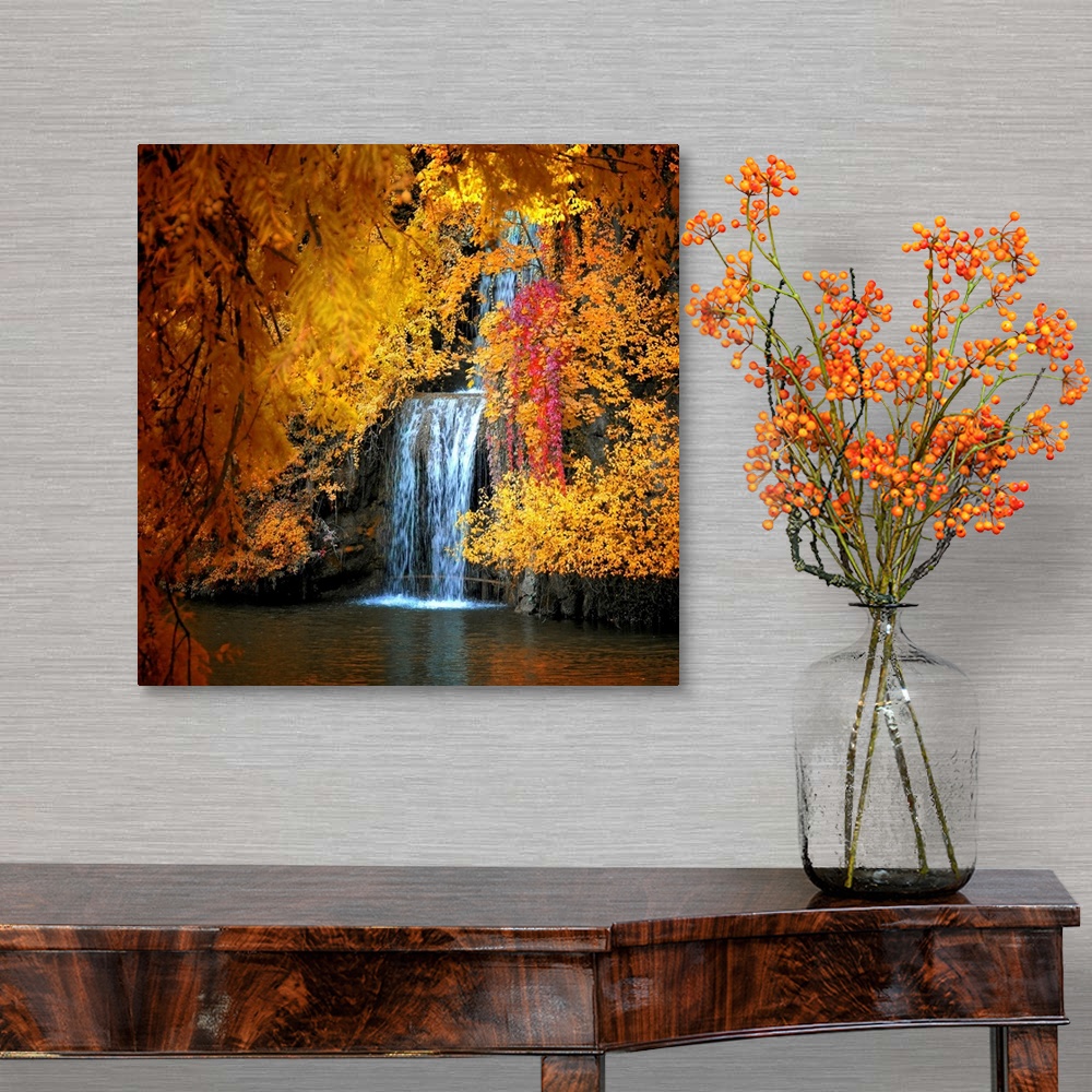 A traditional room featuring Photograph of waterfall seen through the brightly colored autumn leaves.