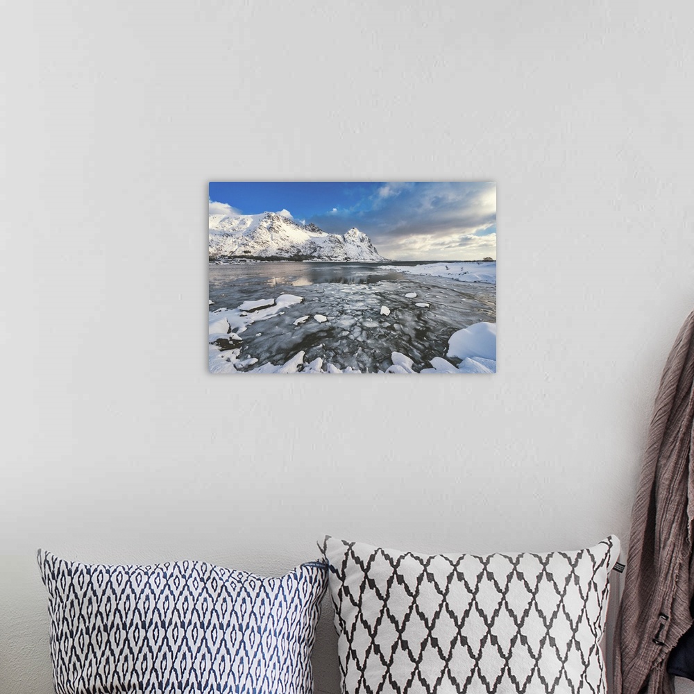A bohemian room featuring A fjord surrounded by snow-capped mountains
