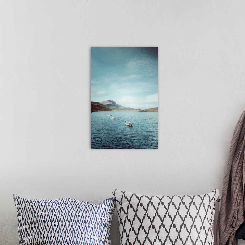 A bohemian room featuring Fine art photo of a few small boats in on the water on a sunny day in Scotland.