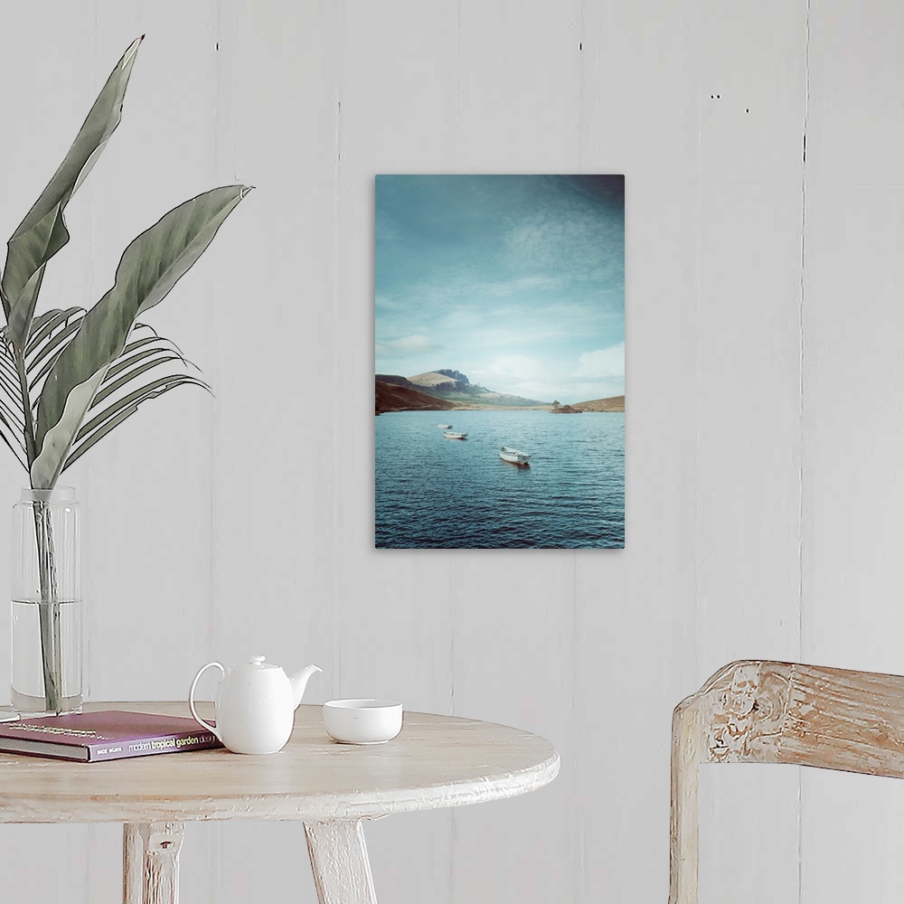 A farmhouse room featuring Fine art photo of a few small boats in on the water on a sunny day in Scotland.