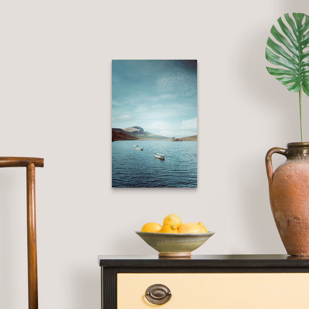 A traditional room featuring Fine art photo of a few small boats in on the water on a sunny day in Scotland.