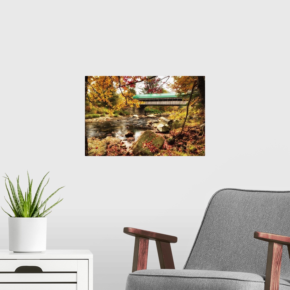 A modern room featuring Fine art photo of a covered bridge in New England over Ellis River in autumn.