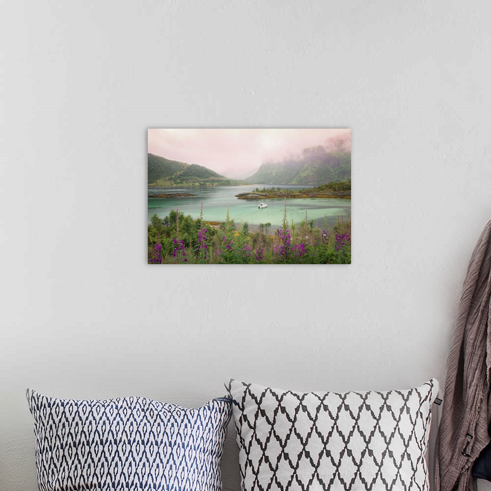 A bohemian room featuring A Norwegian lake below a mountain range under a blanket of thick clouds.
