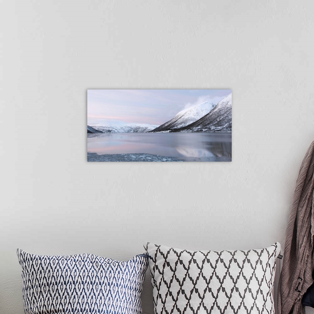 A bohemian room featuring A tranquil cool pink blue mountainscape dawn in the Norweigian snow by a lake.