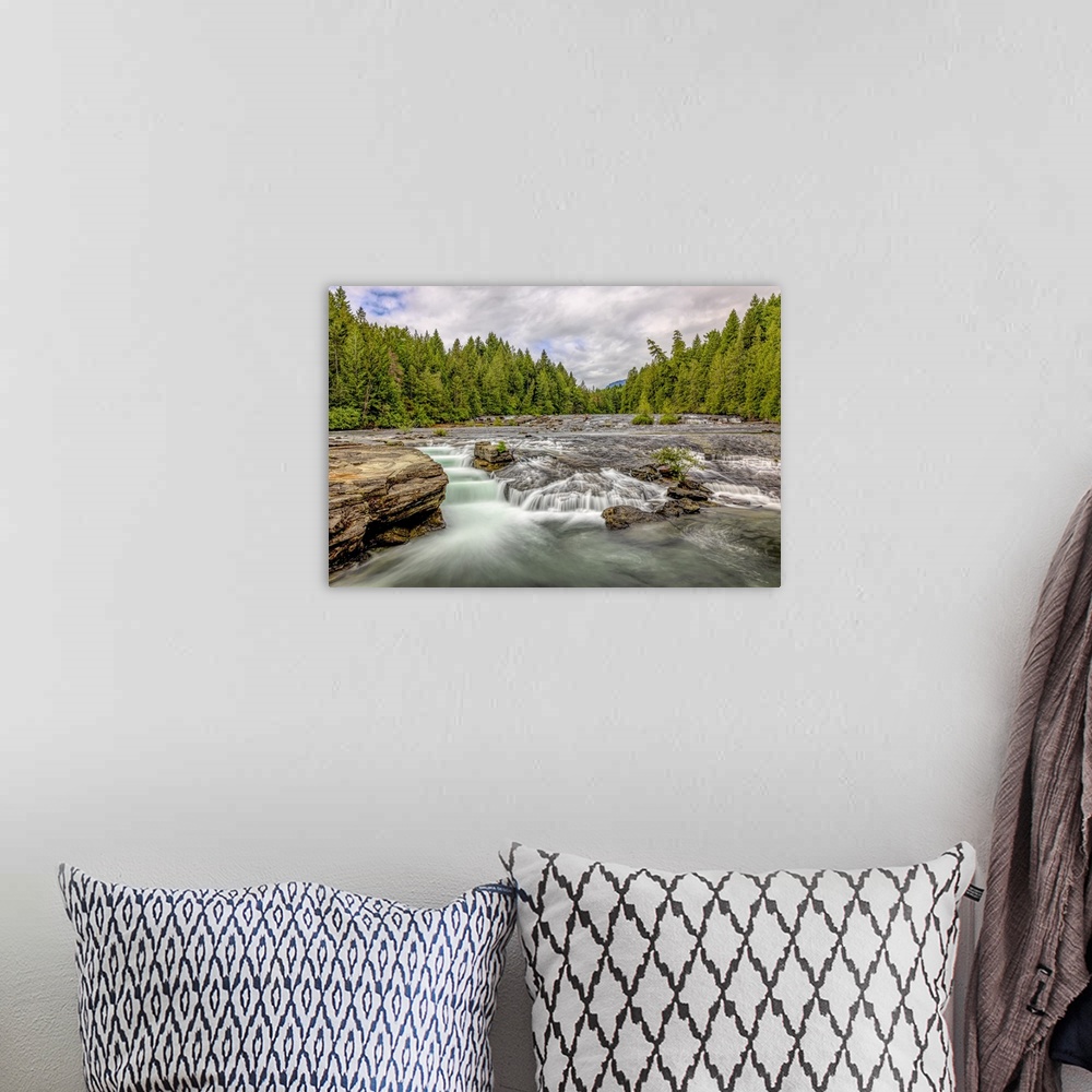 A bohemian room featuring Long exposure of Nymph Falls on Vancouver Island.