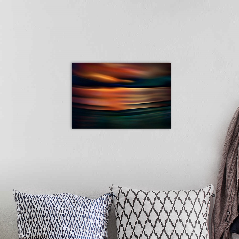 A bohemian room featuring Abstract photograph of blurred and blended colors and flowing lines, with orange waves.