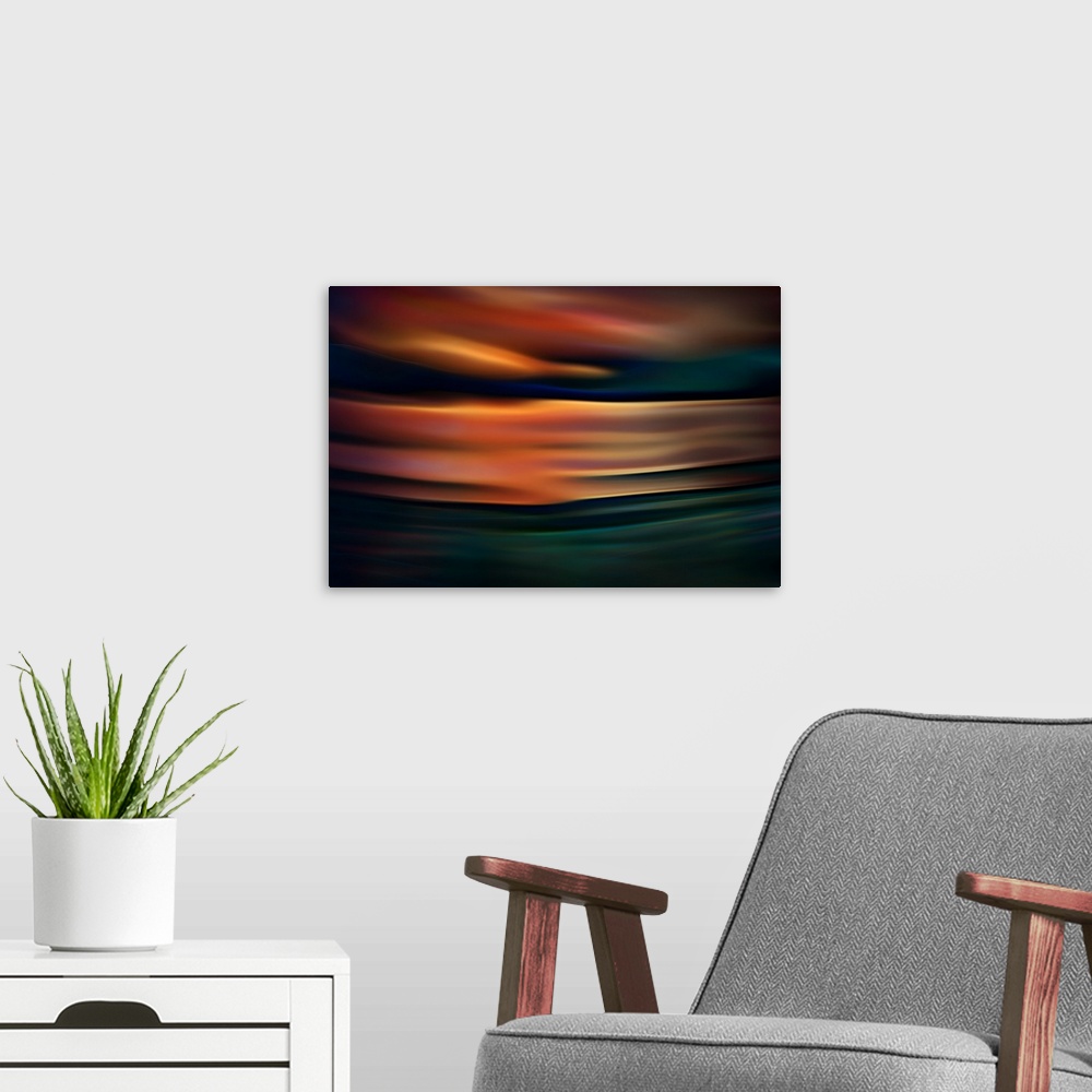 A modern room featuring Abstract photograph of blurred and blended colors and flowing lines, with orange waves.