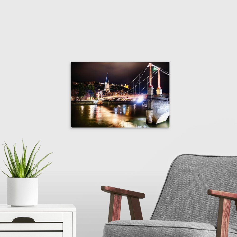 A modern room featuring St George's Footbridge Over the Saone River at Night with Old Lyon , France